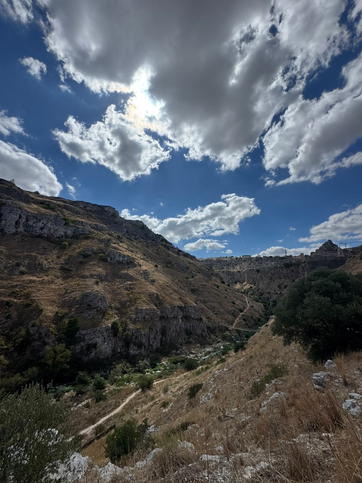 The Gravina canyon below the Sassi of Matera, seen from the path above the ravine